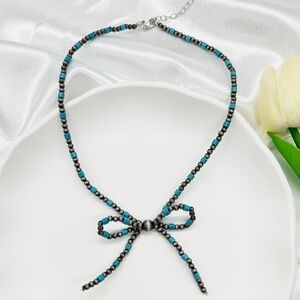 Faux Navajo Pearl Cylinder Turquoise Bow Necklace